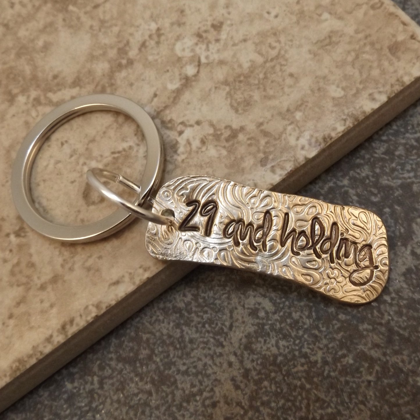 29 and Holding Keychain